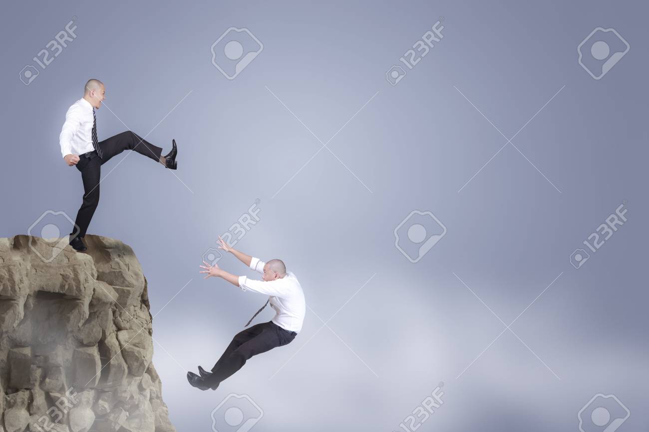 114540643-bad-business-competition-concept-businessman-kicking-down-his-competior-over-the-cliff.jpg