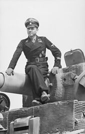 170px-Bundesarchiv_Bild_101I-299-1802-08,_Nordfrankreich,_Michael_Wittmann_auf_Panzer_VI_(Tige...jpg