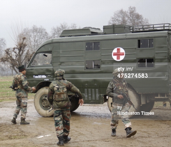 475274583-army-soldiers-stand-alongside-an-ambulance-gettyimages.jpeg