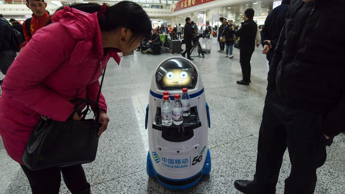 5G robot serving drink d5-lunar-new-year-travel-rush.jpg