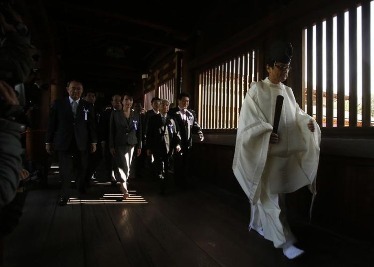 638852-a-group-of-lawmakers-are-led-by-a-shinto-priest-as-they-visit-yasukuni-shrine-in-tokyo.jpg