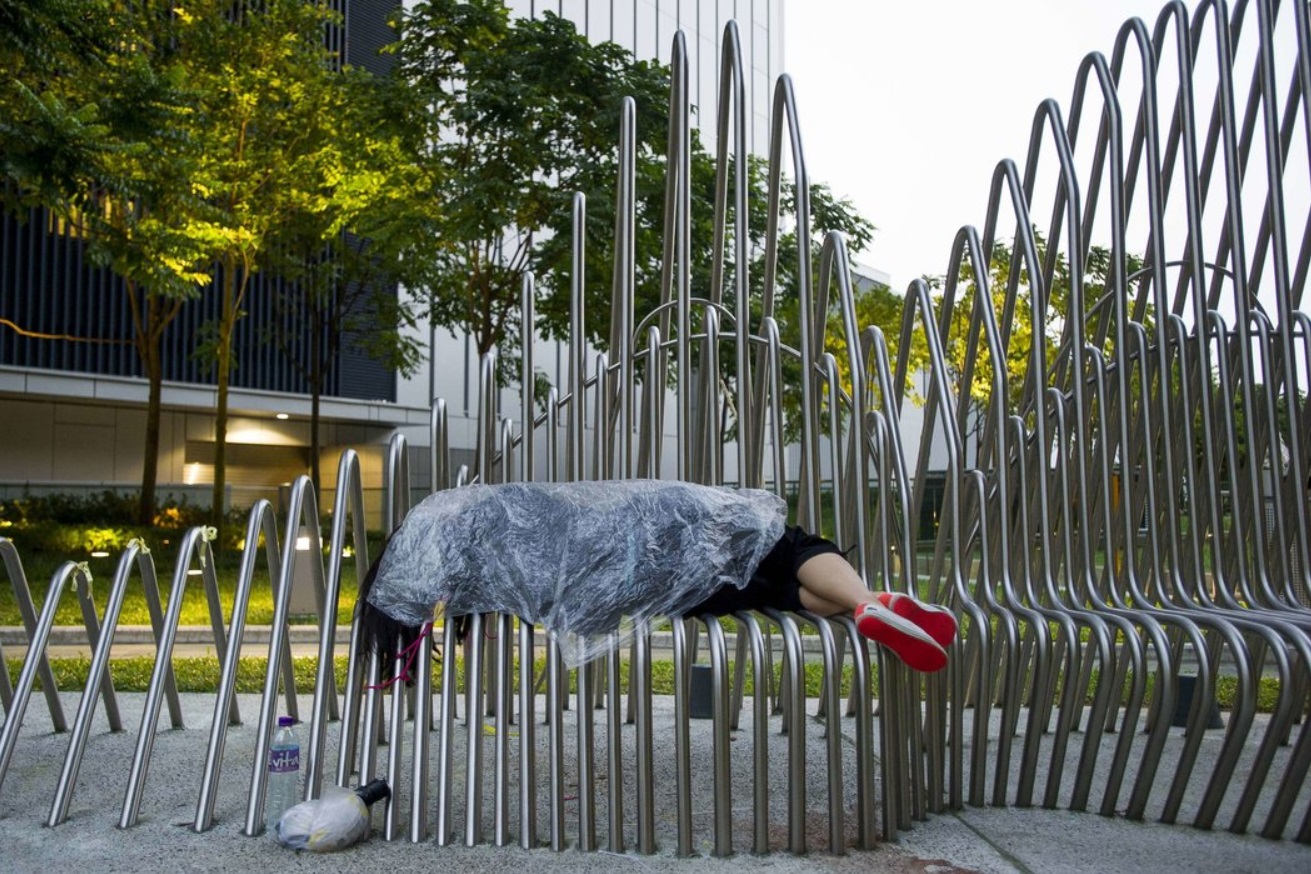 A pro-democracy protester slept at Tamar Park. After a two-day public holiday.jpg