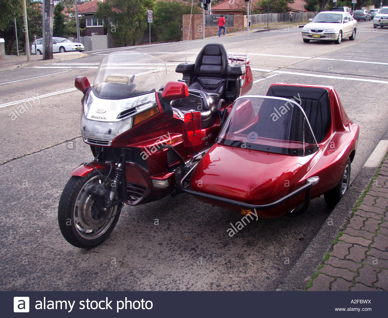 a-red-luxury-honda-motorcycle-and-attached-sidecar-A2FBWX.jpg