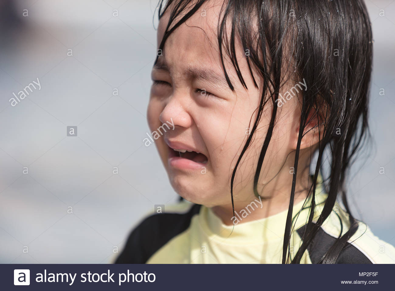 asian-little-chinese-girl-crying-in-swimming-pool-outdoor-MP2F5F.jpg