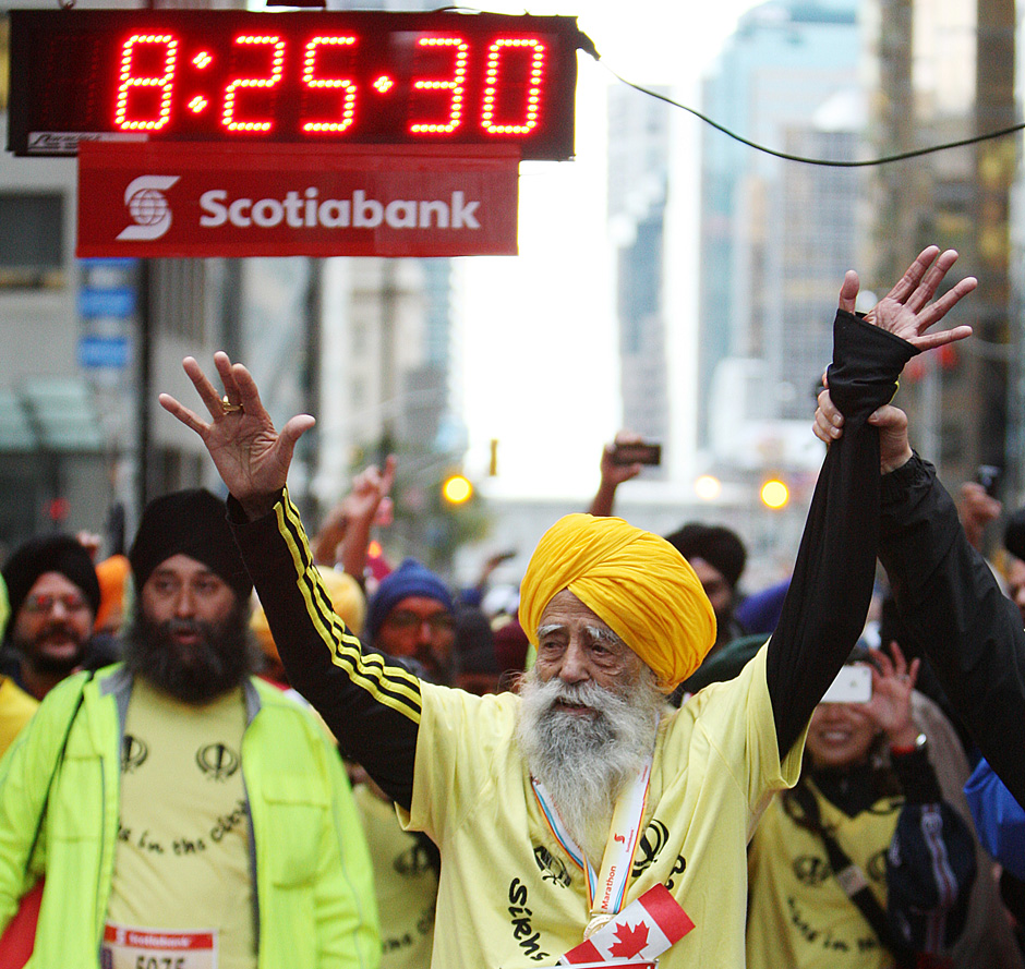 FAUJA-SINGH-WAVES-TO-SUPPORTERS-MINUTES-AFTER-FINISHING-THE-2011-TORONTO-SCOTIABANK-MARATHON.jpg