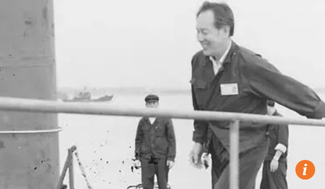 Huang Xuhua - chief designer of China's first nuclear submarine, boards the vessel.png