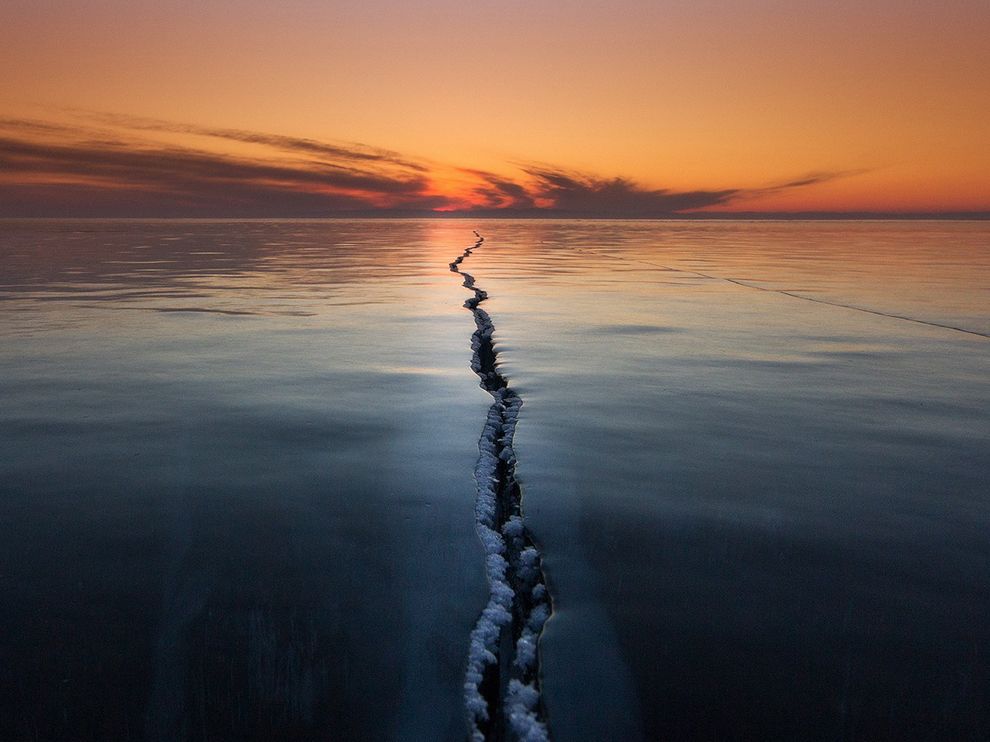 Ice on Lake Baikal is a very interesting phenomenonfrozen-lake-ice-crack_90254_990x742.jpg