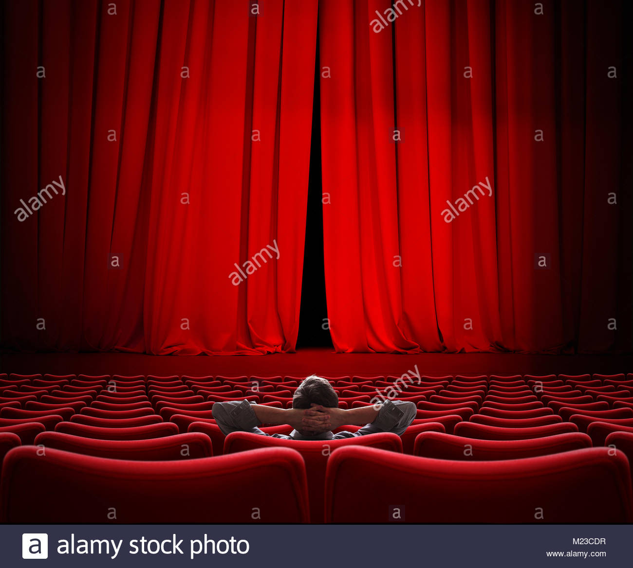 man-sitting-alone-in-vip-movie-theater-hall-3d-illustration-M23CDR.jpg