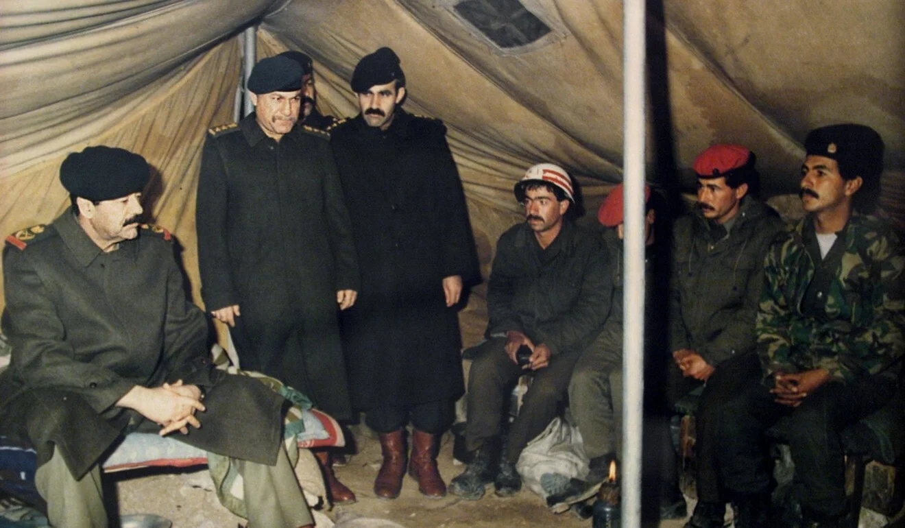 Many Iraqi troops, seen here being visited by Saddam Hussein (left) after their invasion of Ku...jpg