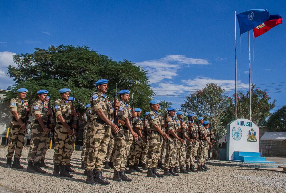 MINUSTAH-Bebe-MINUJUSTH-troops-present-arms.jpeg