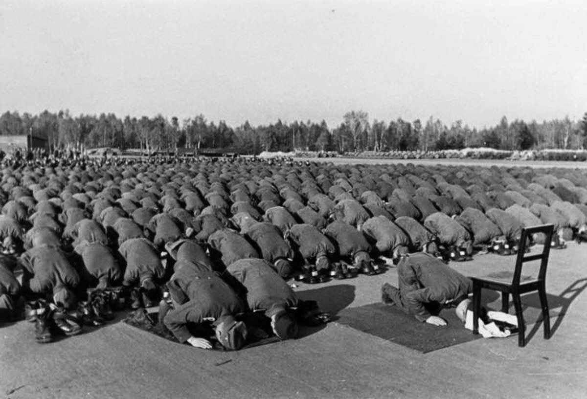 Muslim members of the Waffen-SS 13th division at prayer during their training in Germany,  1943.jpg