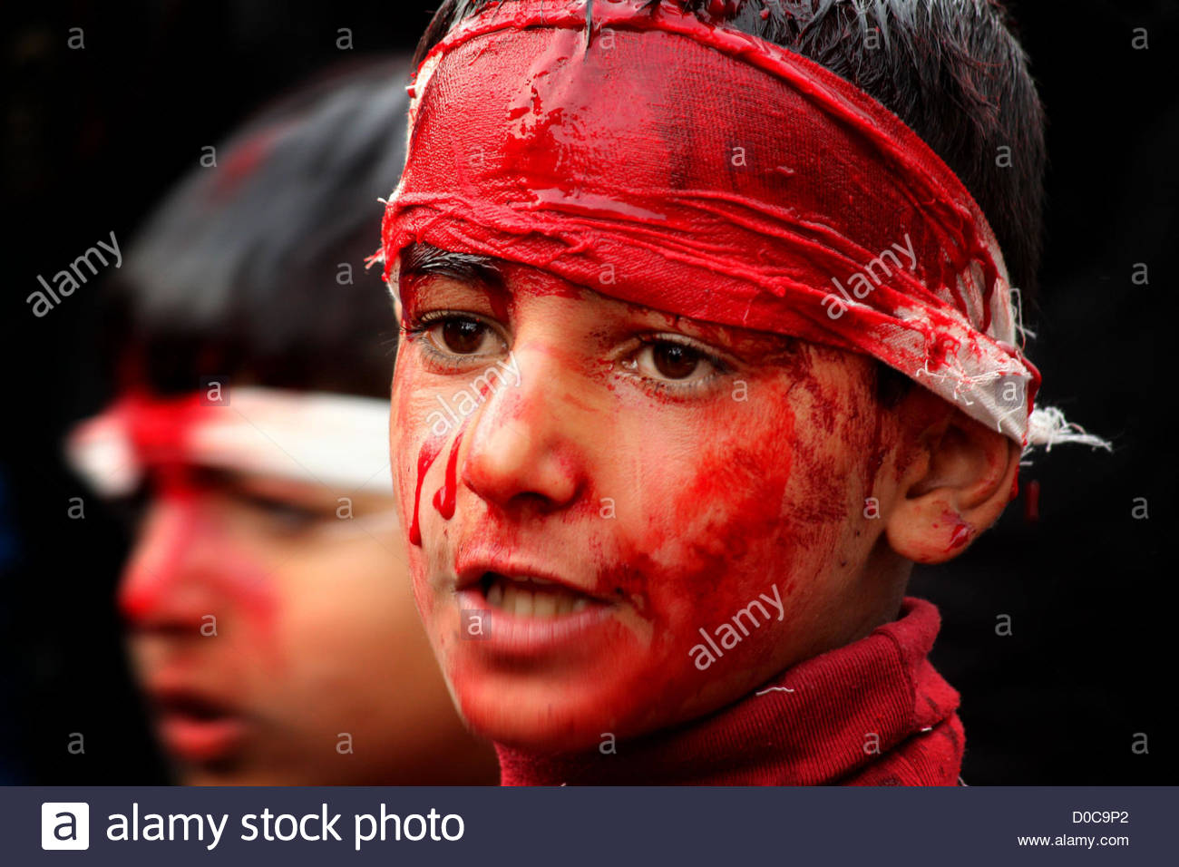 nov-22-2012-srinagar-kashmir-india-blood-runs-down-the-face-of-a-kashmiri-D0C9P2.jpg