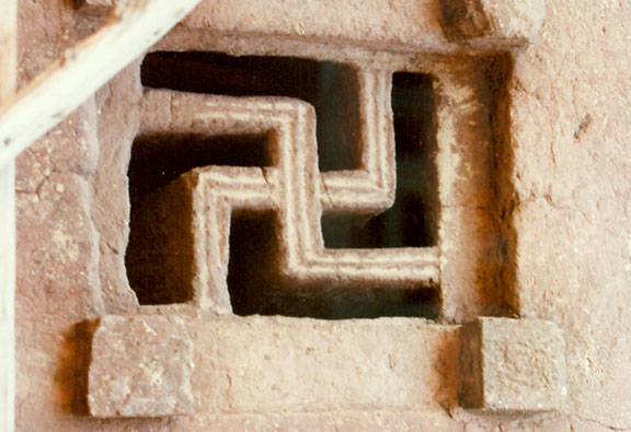 Skastika_symbol_in_the_window_of_Lalibela_Rock_hewn_churches.jpg