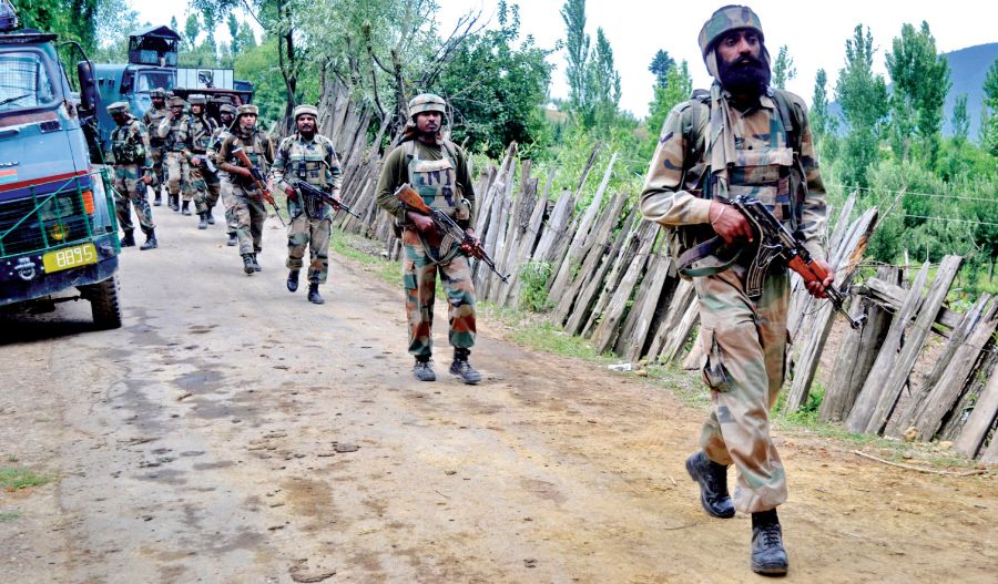 Soldiers-patrol-a-village-in-Handwara-during-an-encounter-on-Wednesday.jpg