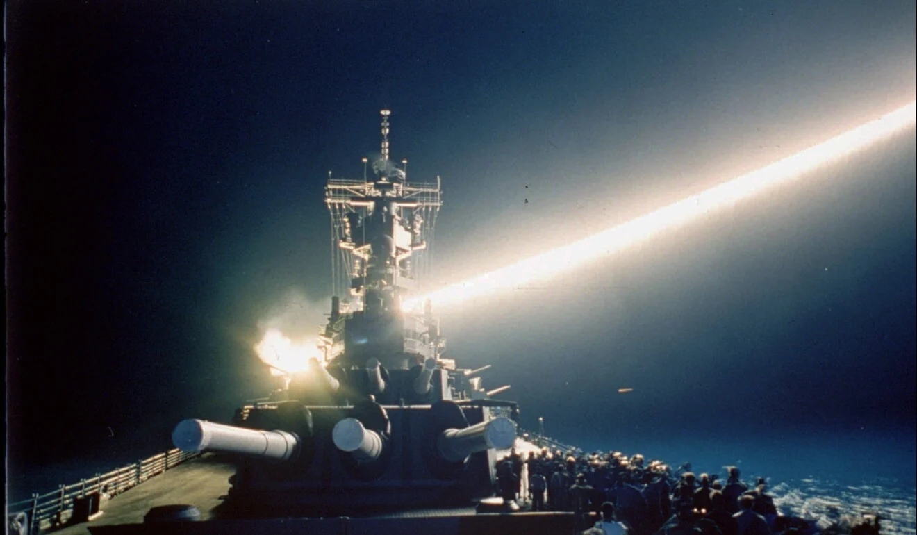 Tomahawk cruise missile lights up the night sky as it is fired from the USS Wisconsin during t...jpg