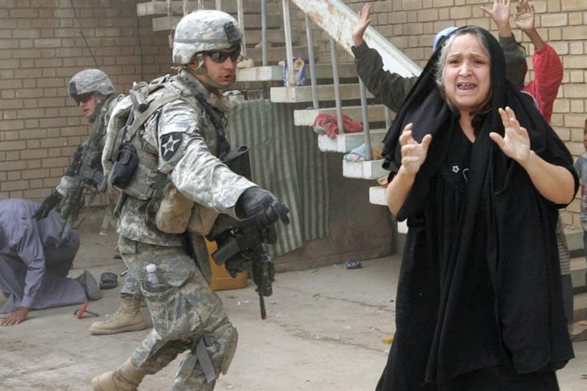 u-s-troops-terrorize-an-iraqi-woman-while-searching-her-husband-and-son-near-baquba-on-october...jpg