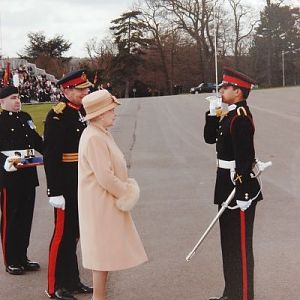 Queen Elizabeth of Britain awarding â€œSword of Honourâ€￾ to Pakistani Officer