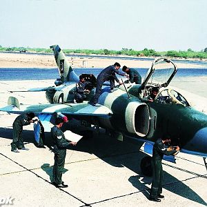 Ground crew busy working on an A-5 before a sortie