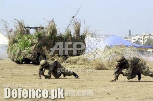 Military Vehicle and Pakistani Soldiers