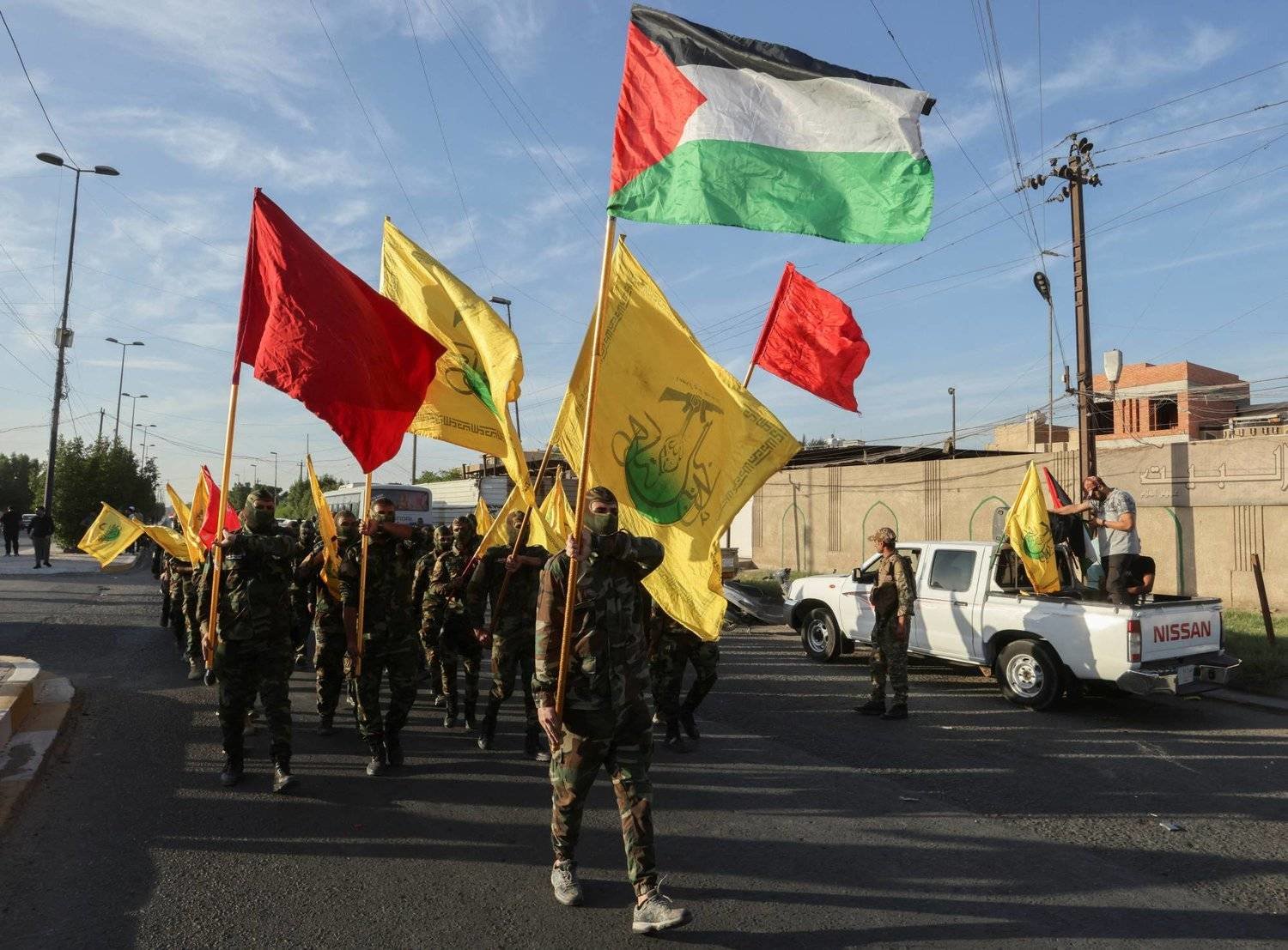 Members of Iraq's Shiite al-Nujaba movement are seen at a rally in Baghdad. (AFP) 