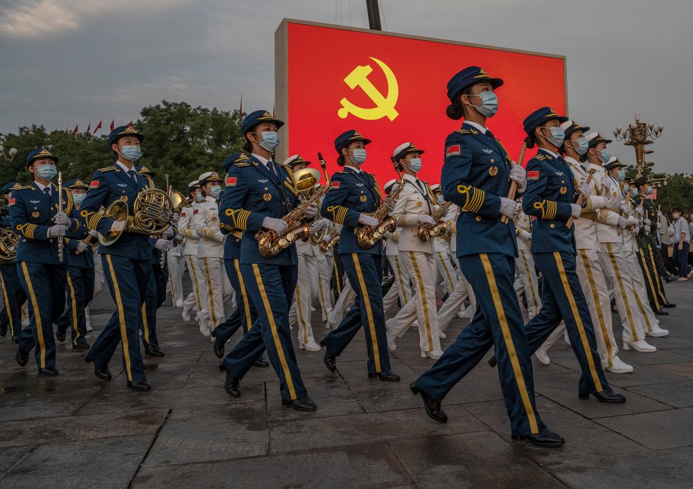 Female members of a People's Liberation Army ceremonial band march at a ceremony marking the 100th anniversary of the Chinese Communist Party in Beijing's Tiananmen Square on July 1.