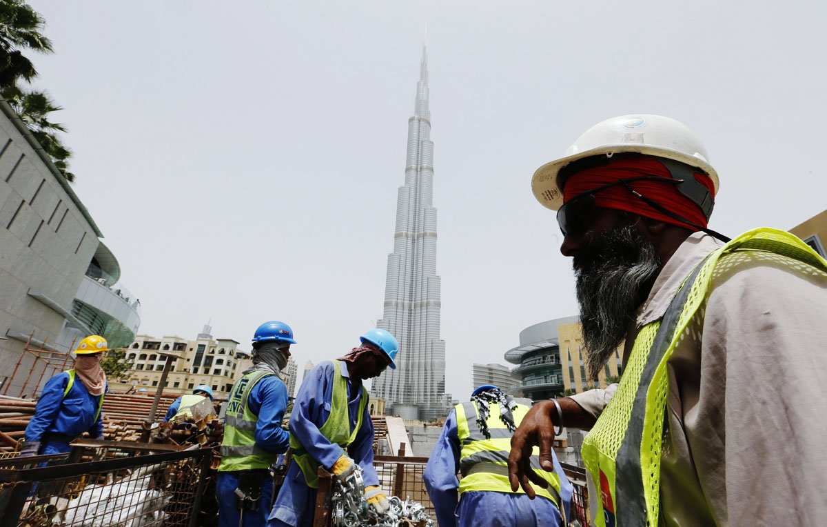 559222-UAElabourersworkersexpatsdubaiphotoreuters-1370444686.jpg