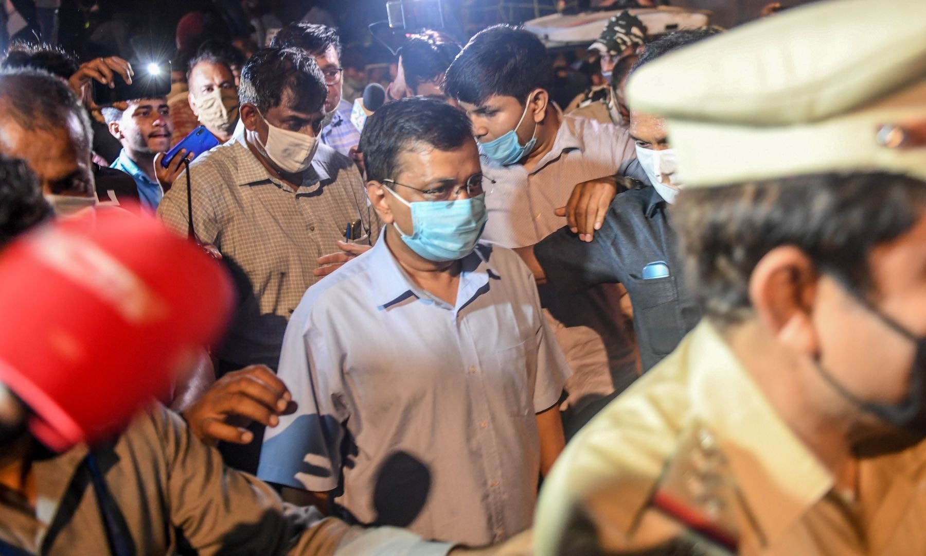 Chief Minister of Delhi Arvind Kejriwal (C) participates in a protest against the alleged gang-rape of a 19-year-old woman in New Delhi. — AFP