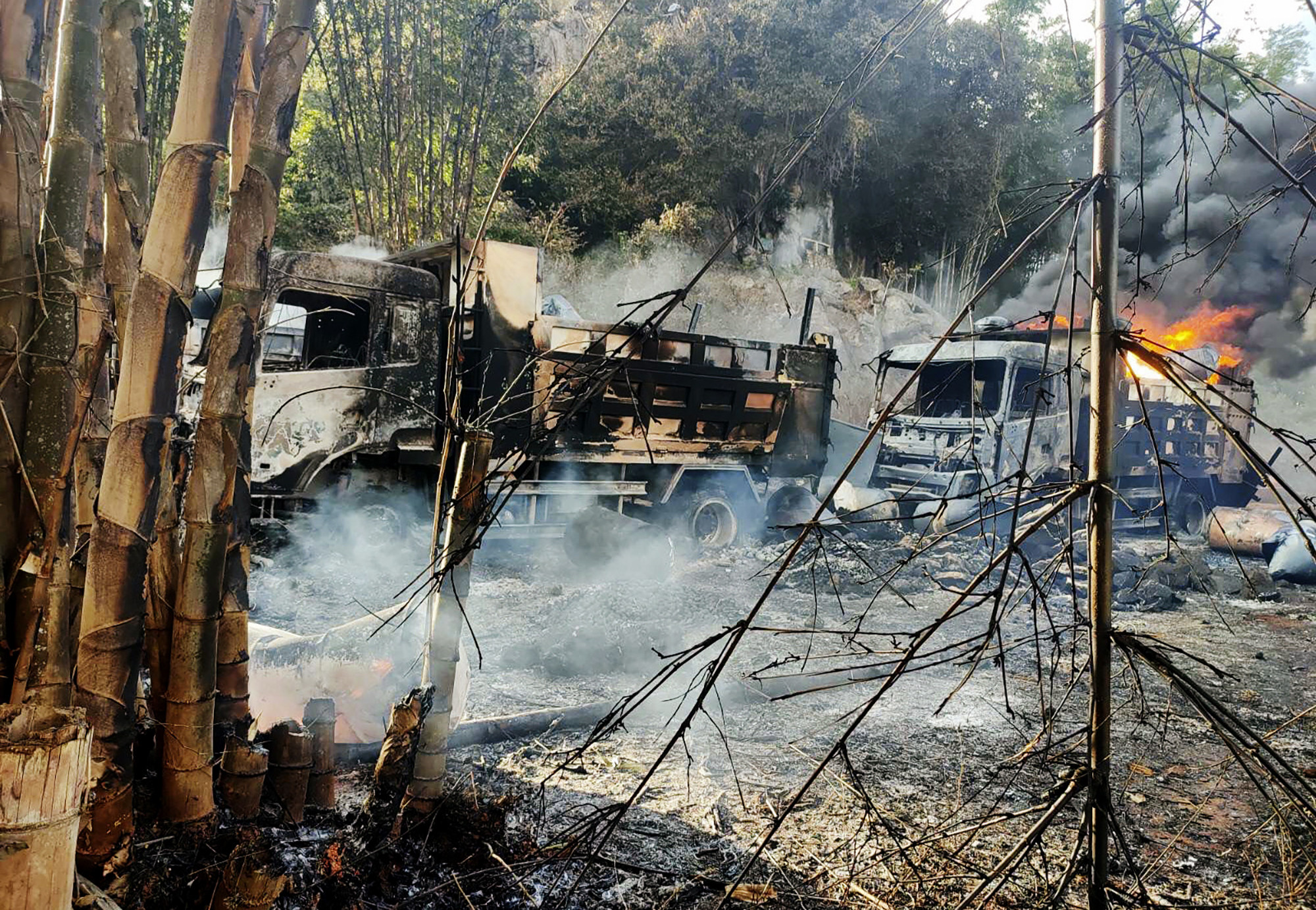 Burning vehicles in Kayah state, Myanmar, where troops are said to have shot then burnt 30 people. Photo: AP