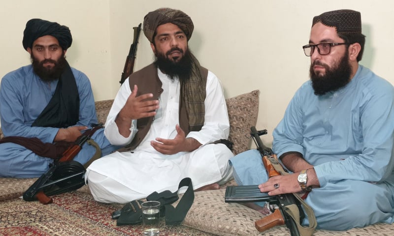 Waheedullah Hashimi (C), a senior Taliban commander, gestures as he speaks with Reuters during an interview at an undisclosed location near the Afghanistan-Pakistan border on August 17. — Reuters