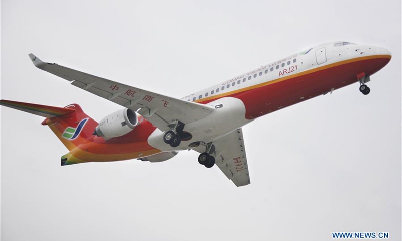 The third ARJ 21-700 jet flies in Shanghai, east China, on Sept. 12, 2009. Subsidiaries of Aviation Industry Corporation of China (AVIC) and Commercial Aircraft Corporation of China Ltd. (COMAC) have set up a joint design center to develop noses for China-developed commercial aircraft, AVIC said Nov. 21, 2018.(Photo: Xinhua)