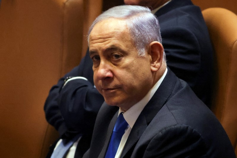 Israeli Prime Minister Benjamin Netanyahu looks on during a special session of the Knesset, Israel's parliament, whereby a confidence vote will be held to approve and swear-in a new coalition government, in Jerusalem June 13, 2021. REUTERS/Ronen Zvulun