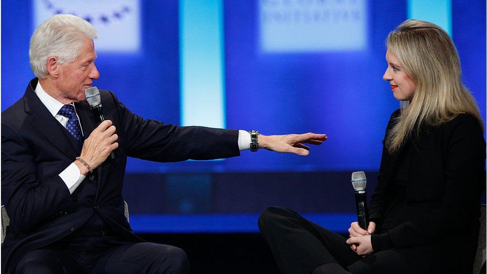 On stage with former US President Bill Clinton in 2015