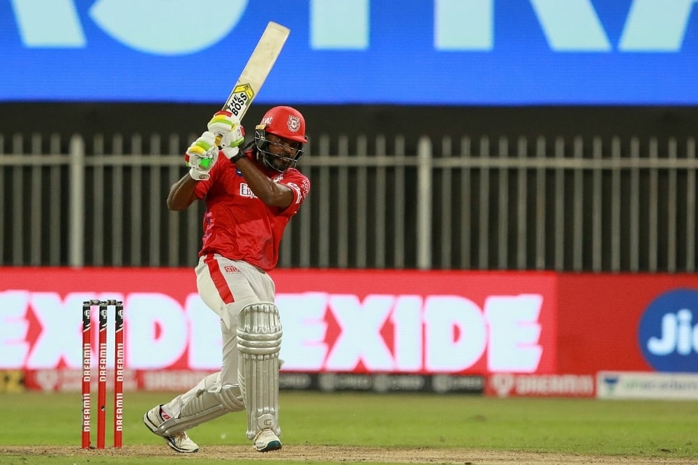 Chris Gayle swats one down the ground, Royal Challengers Bangalore vs Kings XI Punjab, IPL 2020, Sharjah, October 15, 2020. — Photo courtesy BCCI