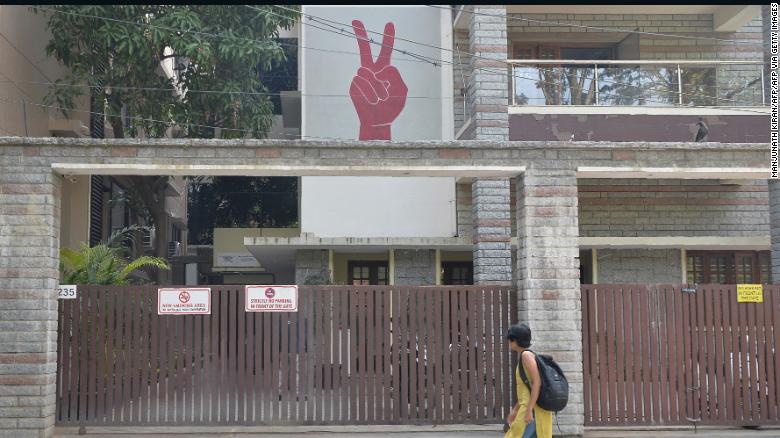 A pedestrian walks past the Amnesty International office in Bangalore on October 26, 2018, shortly after it was raided by Indian authorities.