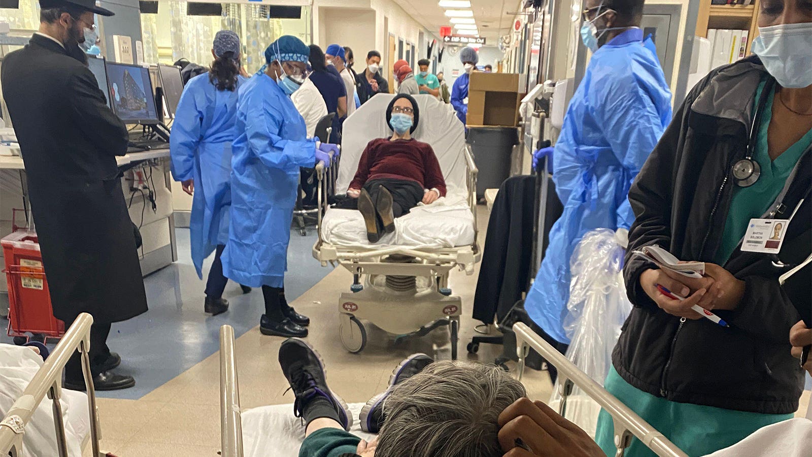 A photo of a crowded hospital hallway.