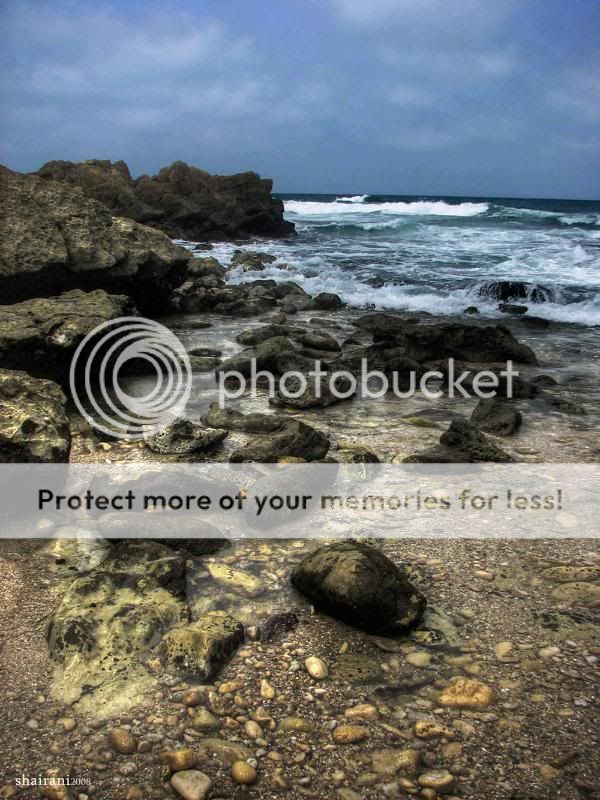 Rocks_Sky_Clouds_Sea_Sand_by_shaira.jpg