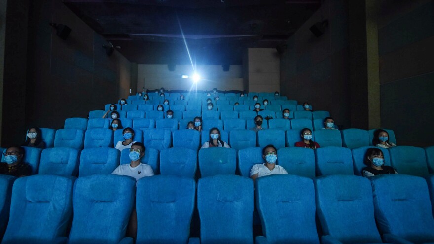 Audience members sit separately for social distancing at a cinema in China's eastern Zhejiang province in July 2020.