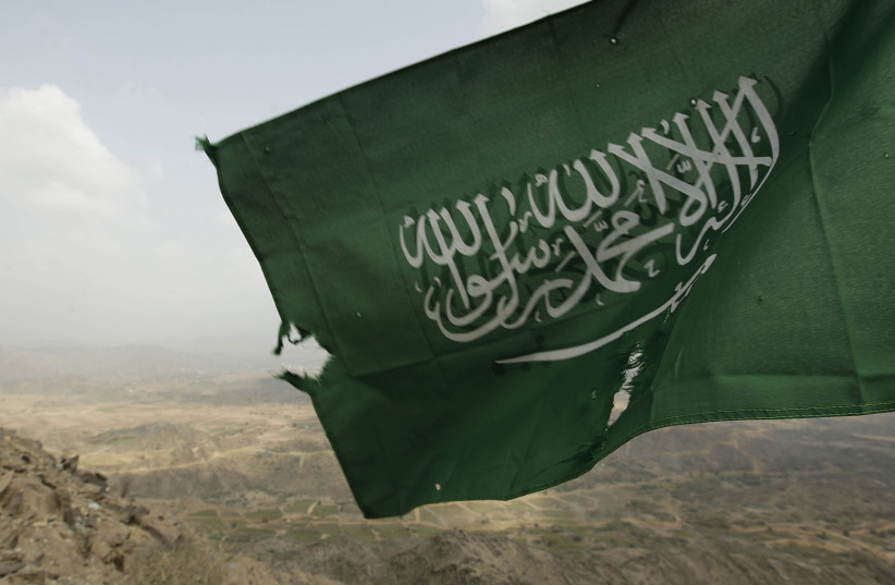  Saudi Arabia's national flag is seen at the Khoba frontline border with Yemen (credit: REUTERS/FAHAD SHADEED)