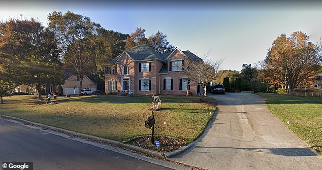 Christopher Stanton Georgia, 53, was found dead at his home, pictured, in Alpharetta