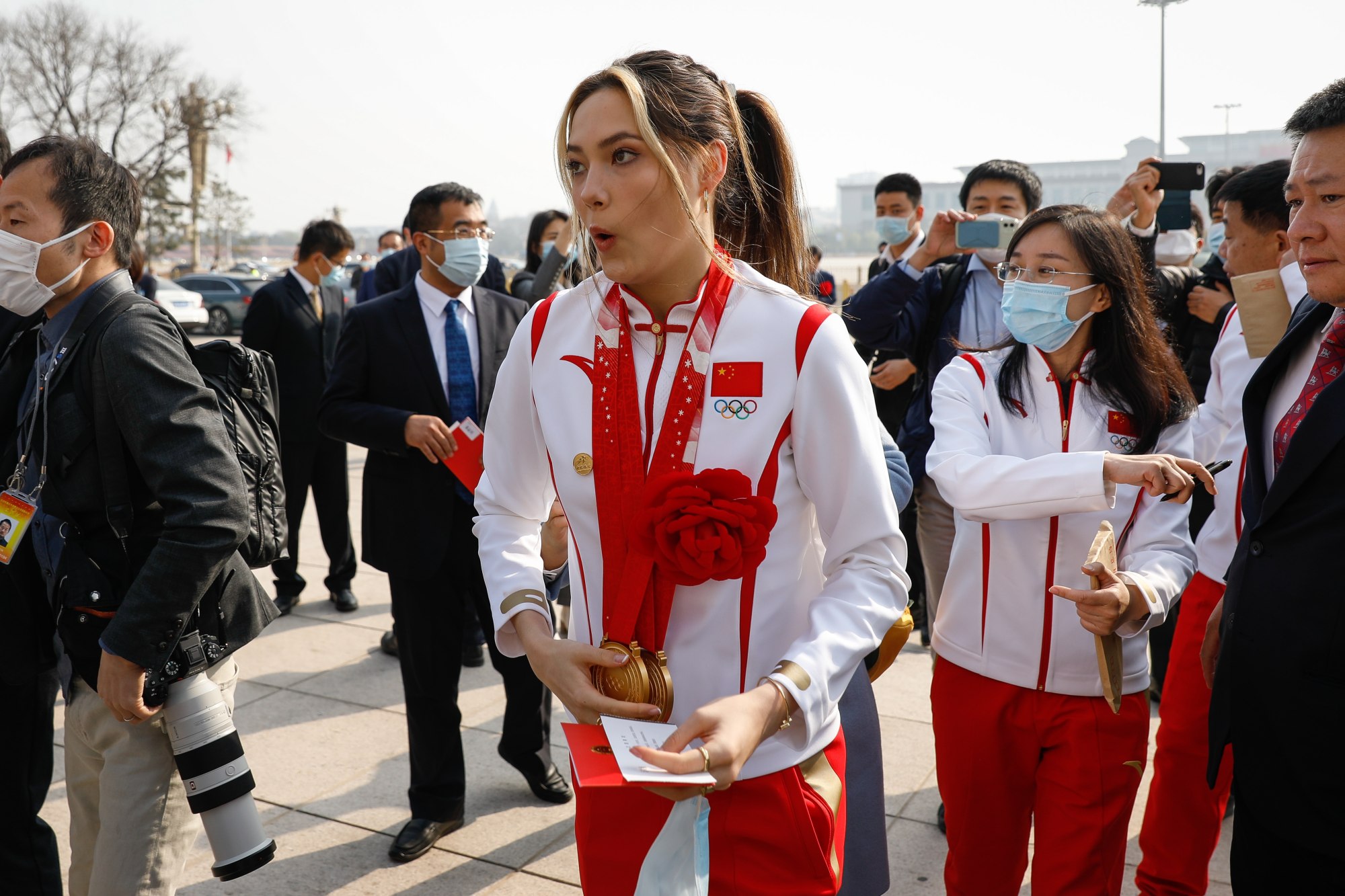 Chinese Olympian Eileen Gu reacts after being mobbed by fans and journalists in Beijing. Photo: EPA-EFE