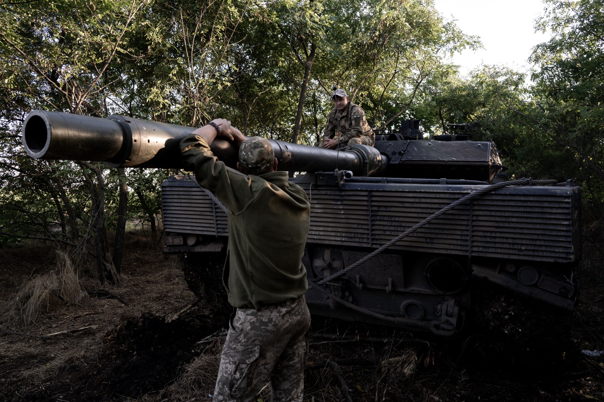 Ukrainian servicemen with a Leopard 2 tank on the front line near Tokmak in Zaporizhia region, Ukraine, on Sept. 15.