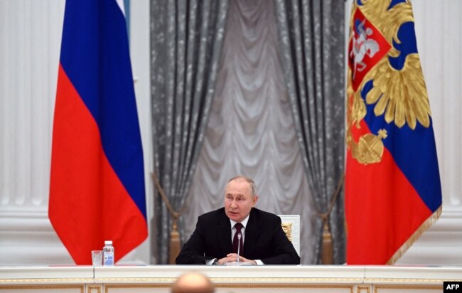 Russian President Vladimir Putin chairs a meeting with secretaries of foreign security councils on Afghan issues at the Kremlin in Moscow, Feb. 8, 2023.