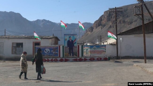 National flags and propaganda posters flown on the streets of a Tajik town near the Afghan border.