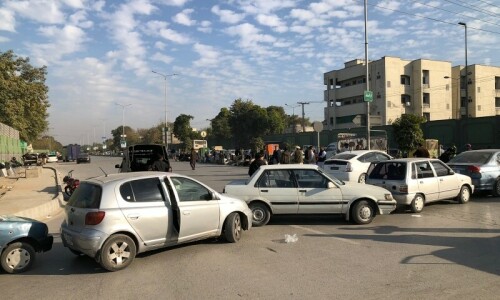  Cars line up at the Khyber Road after protest in Peshawar on Friday. — Photo by Sirajuddin