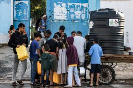 Water sold by private vendors who run small solar-powered desalination facilities has doubled in price in Gaza since October 7 [Mohammed Abed/ AFP]