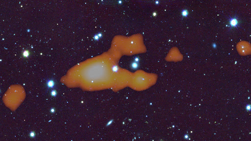 An overlay of MeerKAT 21-cm neutral hydrogen gas on a deep optical image. (Source: SARAO.)