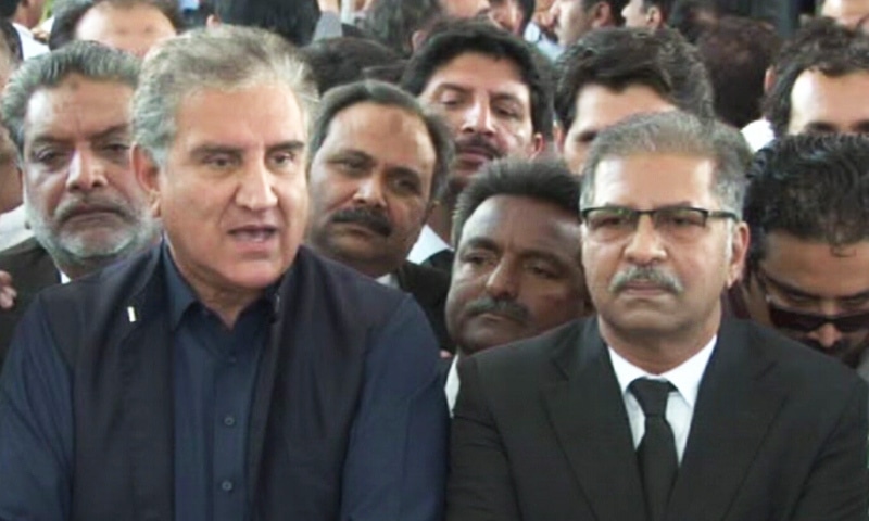  PTI’s Shah Mahmood Qureshi and Barrister Ali Zafar talk to media persons outside SC on Tuesday. — DawnNewsTV