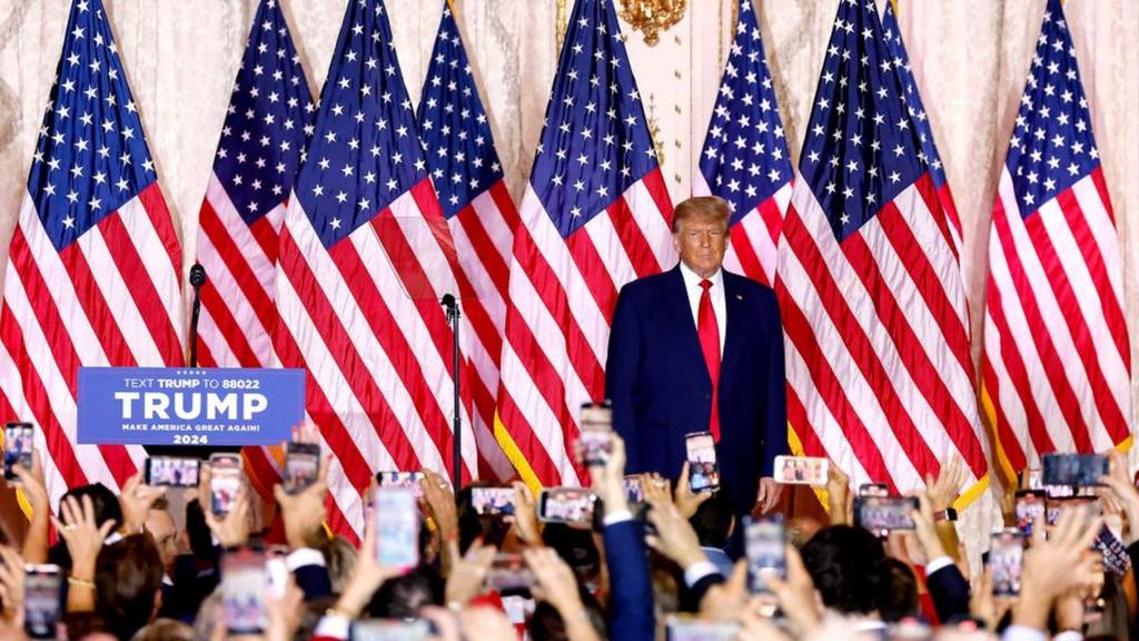 Image shows Trump at the podium