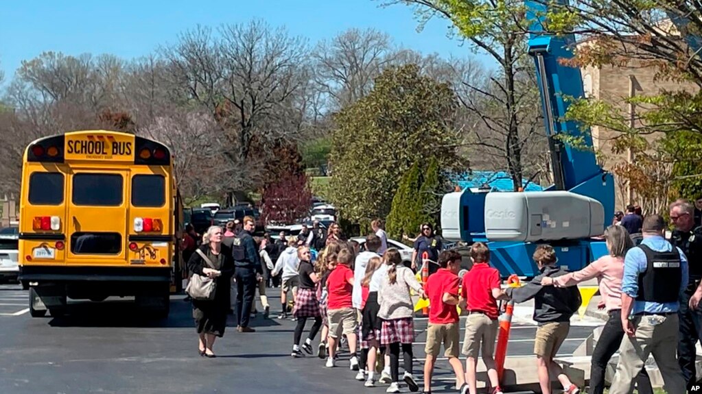 FILE - Students are taken to a reunification site after a deadly shooting at their school in Nashville, Tennessee, March 27, 2023. The United States is setting a record pace for mass killings in 2023, with an average of one every 6.53 days, according to a data analysis.