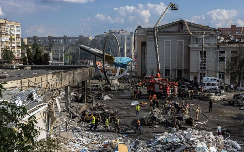 Firefighters, rescuers, military personnel and the police working at the site of the deadly Russian missile strike in downtown Vinnytsia, Ukraine - ROMAN PILIPEY/EPA-EFE/Shutterstock